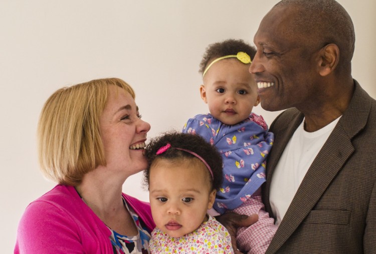 U.S. Ambassador John L. Estrada, his wife, Dr. Elizabeth Cote Estrada, and their 14-month-old twin daughters, Eva, left, and Marie, will be heading to the Republic of Trinidad and Tobago in the Caribbean this month.