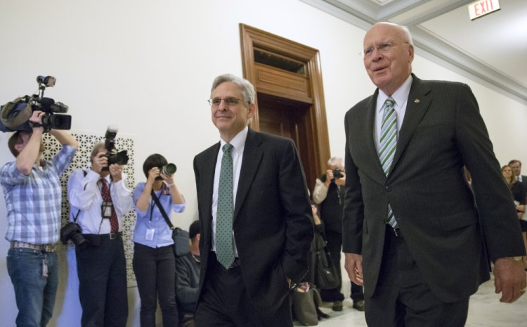 Sen. Patrick Leahy, D-Vt., right, the top Democrat on the Senate Judiciary Committee, walks with Judge Merrick Garland, President Obama’s choice to replace the late Justice Antonin Scalia on the Supreme Court, on Capitol Hill in Washington on Thursday. U.S. Sen. Susan Collins of Maine is one of the few Republicans who said she would be willing to meet with Garland.