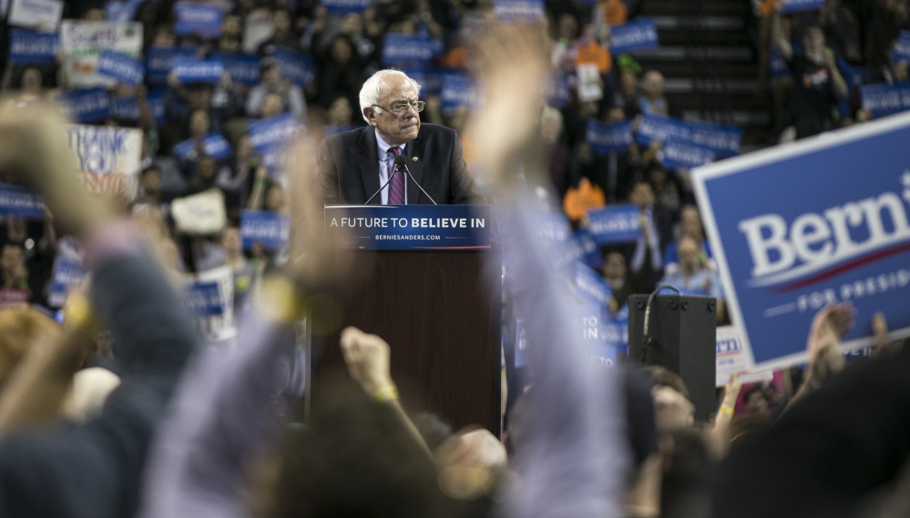 Democratic presidential candidate Sen. Bernie Sanders, I-Vt., speaks at a campaign rally in Seattle. He won Saturday's caucuses in Washington and Alaska.