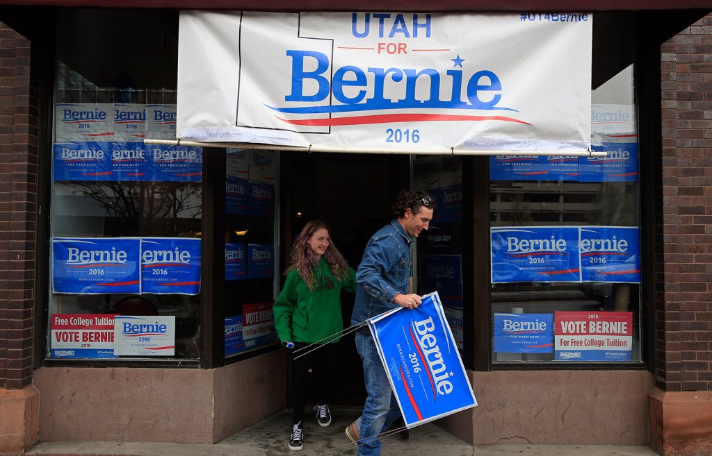 People walk out of a Bernie Sanders campaign office in Salt Lake City on Tuesday, the day of Utah's Democratic caucuses.