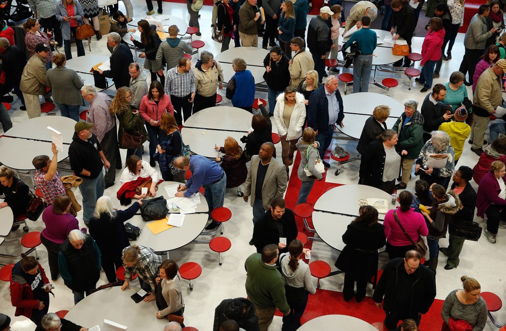 Voters assemble at a Republican caucus site Tuesday in Salt Lake City. The state Democratic Party's website crashed because of heavy traffic.