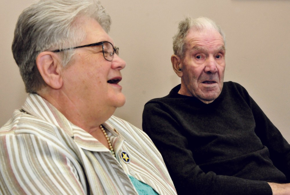 Beecher Ladd, 95, listens Tuesday as his daughter-in-law Marilyn Ladd, speaks his 77-year marriage to his late wife, Ginny. Beecher is scheduled to receive the Remember ME Lifetime Achievement award in Augusta.