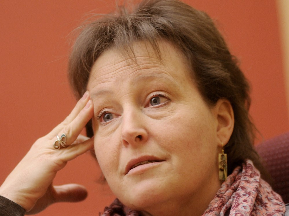 Susan Cloutier discusses a bill Monday that would compensate her for the loss of her husband and son.