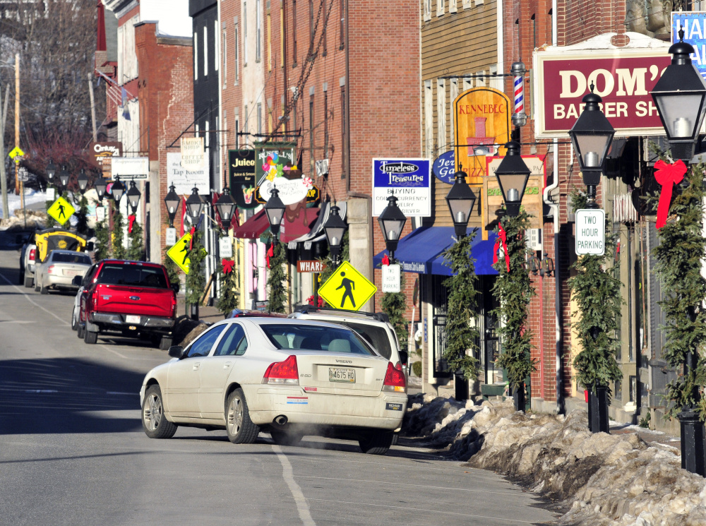 A car pulls out of a parking spot on Jan. 5 along Water Street in Hallowell, where a major reconstruction project is set for 2018.