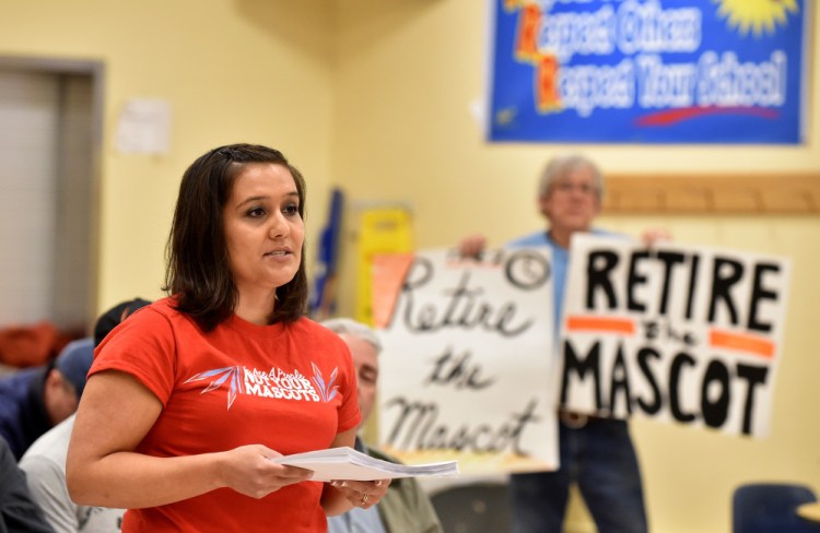 Maulian Smith offers words to the Skowhegan school board before presenting them with a petition to change the Skowhegan Area High School Indians mascot during a meeting at Skowhegan Middle School on Thursday.