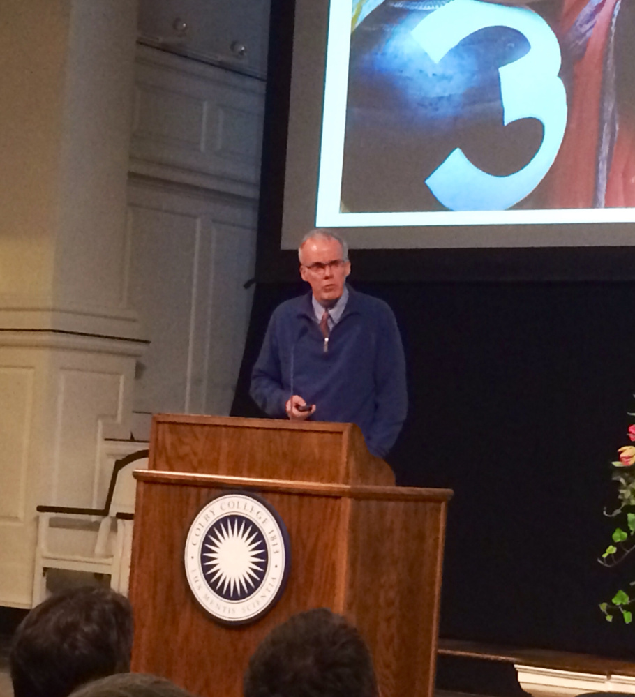 Author and environmentlist Bill McKibben, founder of the grass-roots climate change group 350.org, urges an audience on Thursday night at Colby College to fight the swift-moving affects of climate change.