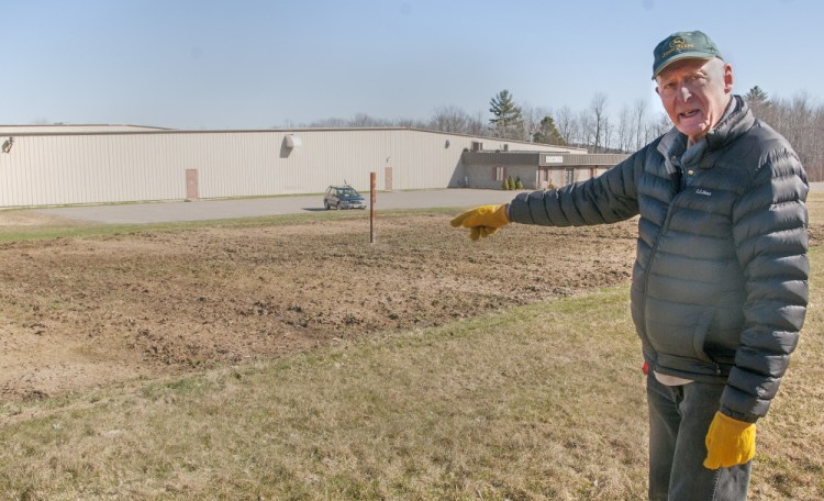 Bob Mulliken talks about the Monmouth Community Garden last week at the garden site at 904 Main St. in Monmouth.