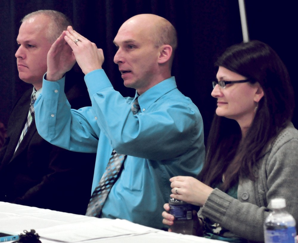 Waterville Detective-Sgt. Bill Bonney takes part in a panel discussion about sexual violence issues Monday at Thomas College in Waterville. At left is Kennebec County Sheriff Ryan Reardon, and at right is clinical social worker Jackie Dupont.