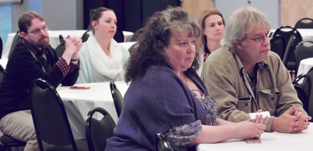 Attendees listen to panelists discussing sexual violence issues Monday at Thomas College in Waterville.