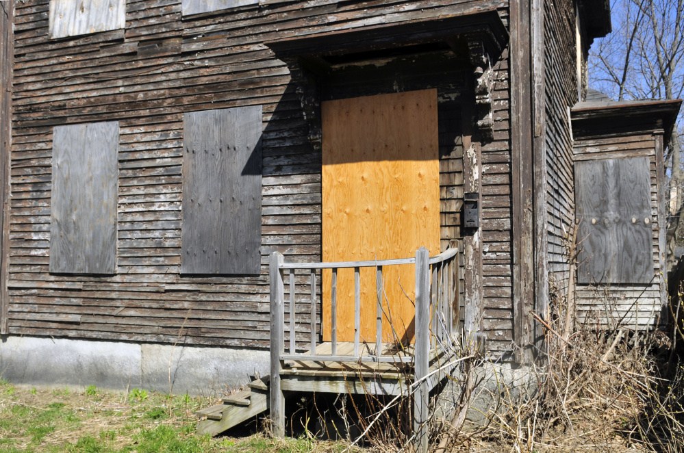 This April 5 photo shows 5 Patterson St. in Augusta. A property maintenance ordinance enacted Thursday by the City Council prohibits boarding up windows.
