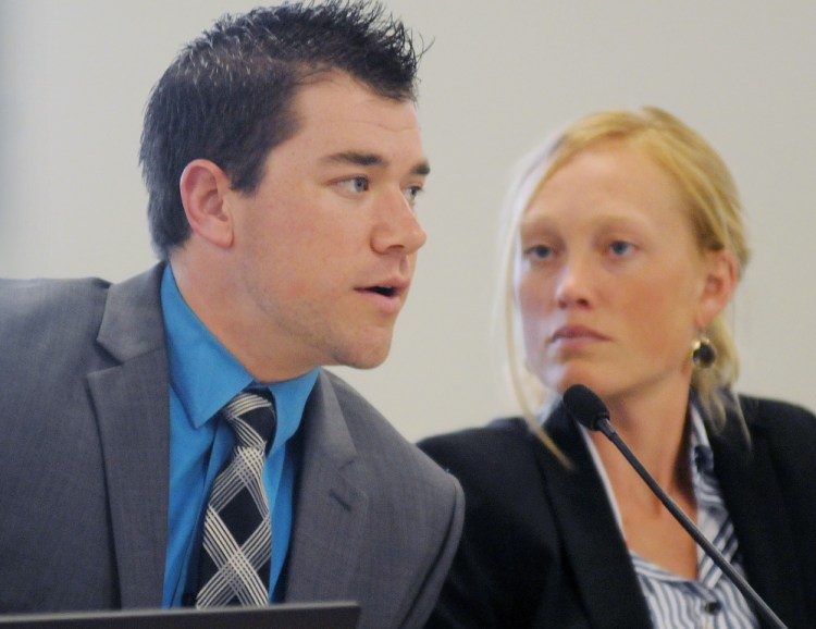 Burns & McDonnell engineer Gabriel Weger presents information about noise emanating from a substation in Benton before a hearing officer Wednesday at the Maine Public Utility Commission in Hallowell as his colleague, Katryn Mitchell, listens. The firm was retained by Central Maine Power, the utility that owns the substation.