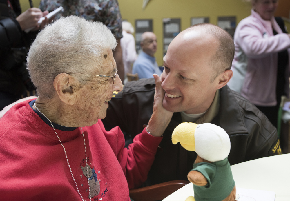 Clara Swan greets a nephew, Will Sheehan, at Husson University on Thursday.