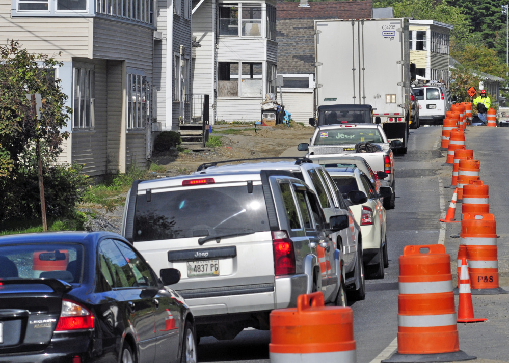 A flagger directs traffic Oct. 5, 2015, on Mount Vernon Avenue in Augusta, where paving is scheduled to begin on Monday.