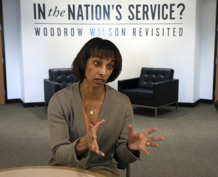 Cecilia Rouse, Dean of the Woodrow Wilson School of Public and International Affairs, answers a question as she sits near an exhibit titled, "In the Nation's Service? Woodrow Wilson Revisited," Sunday at the school in Princeton, N.J.