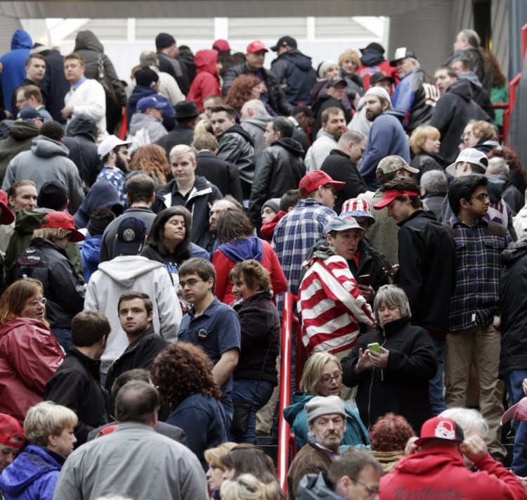 Supporters of Republican presidential candidate Donald Trump wait to get into the Times Union Center for a rally in Albany, N.Y., this month. He has the reputation to some of being a philanthropist, but charity records show he has donated little of his own money recently.