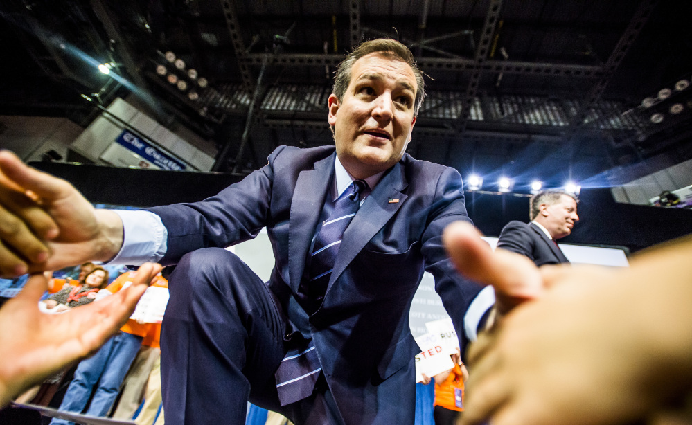 U.S. Sen. Ted Cruz shakes hands with supporters in Colorado Springs on Saturday. He is scooping up scores of delegates who have pledged to vote for him instead of Donald Trump if they are given the chance.