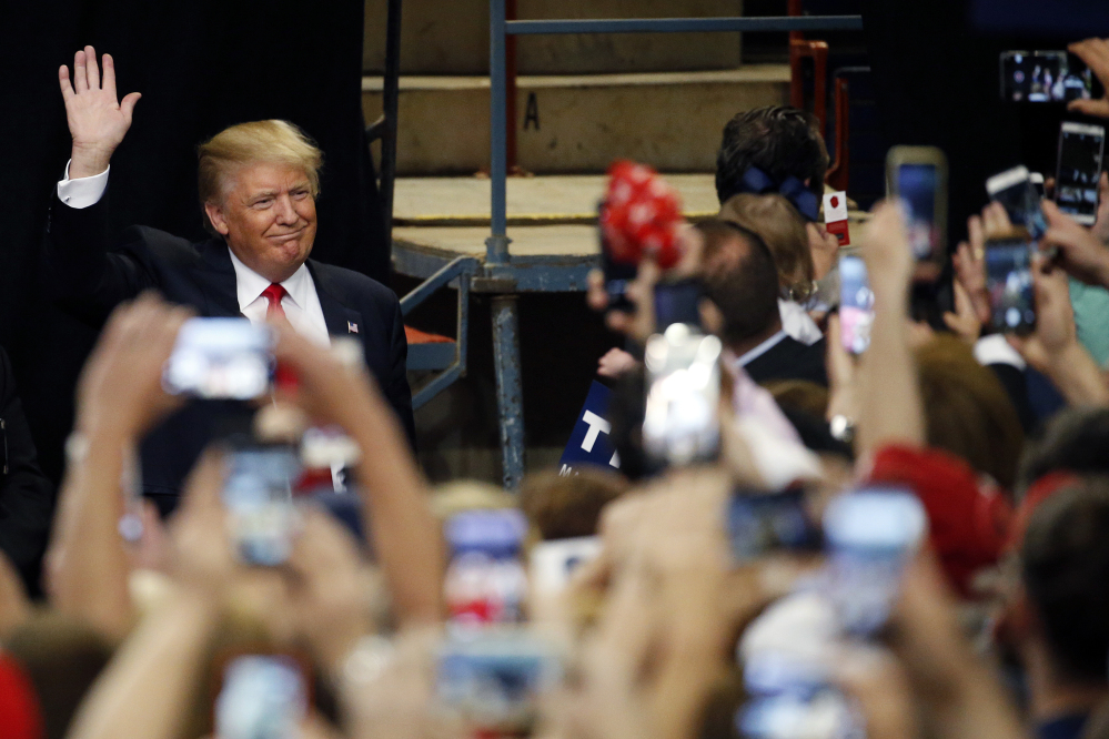 Republican presidential candidate Donald Trump arrives at a rally Thursday at the Pennsylvania Farm Show Complex and Expo Center in Harrisburg, Pa. 