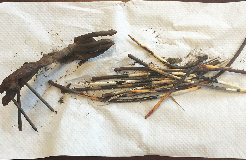 Police display the few pieces left behind from the theft of the porcupine sculpture at the airport.