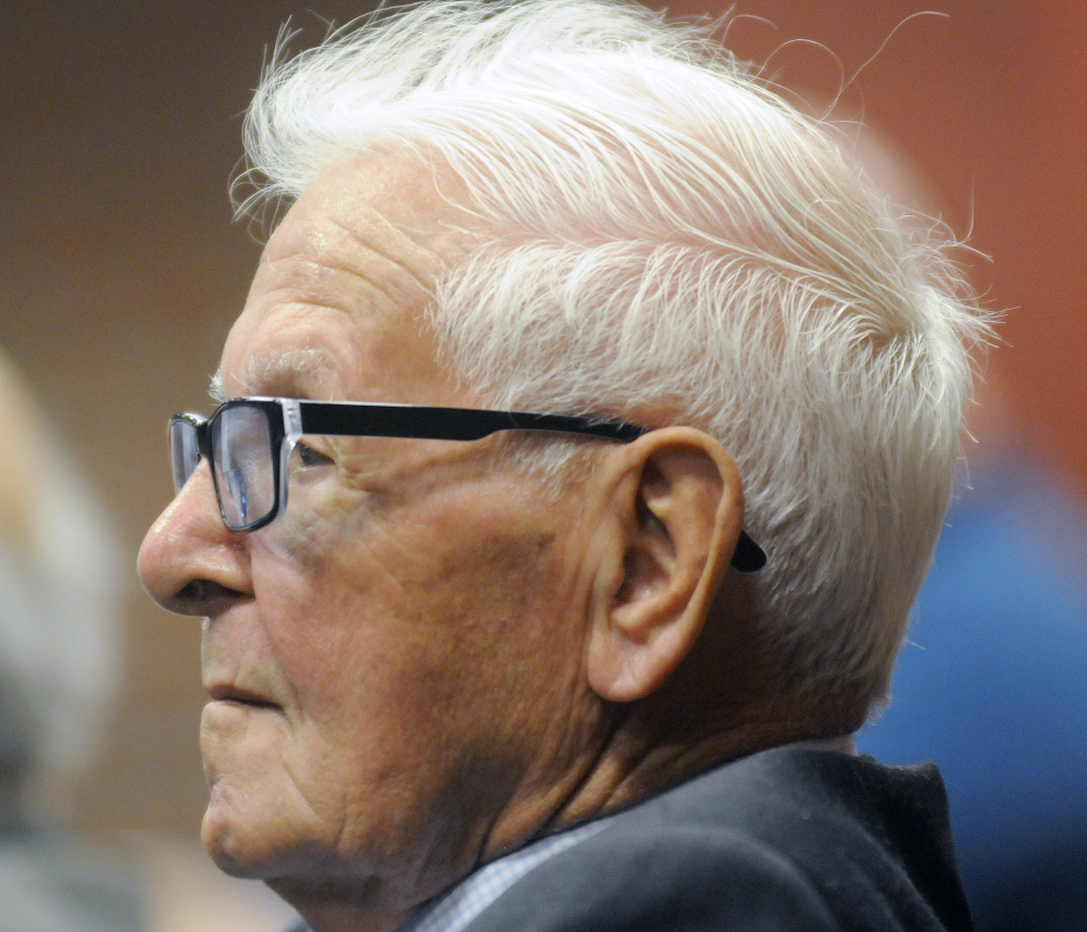 Holocaust surviver Max Slabotsky observes the Holocaust Day of Remembrance hosted by the Holocaust and Human Rights Center of Maine in Augusta on Sunday.