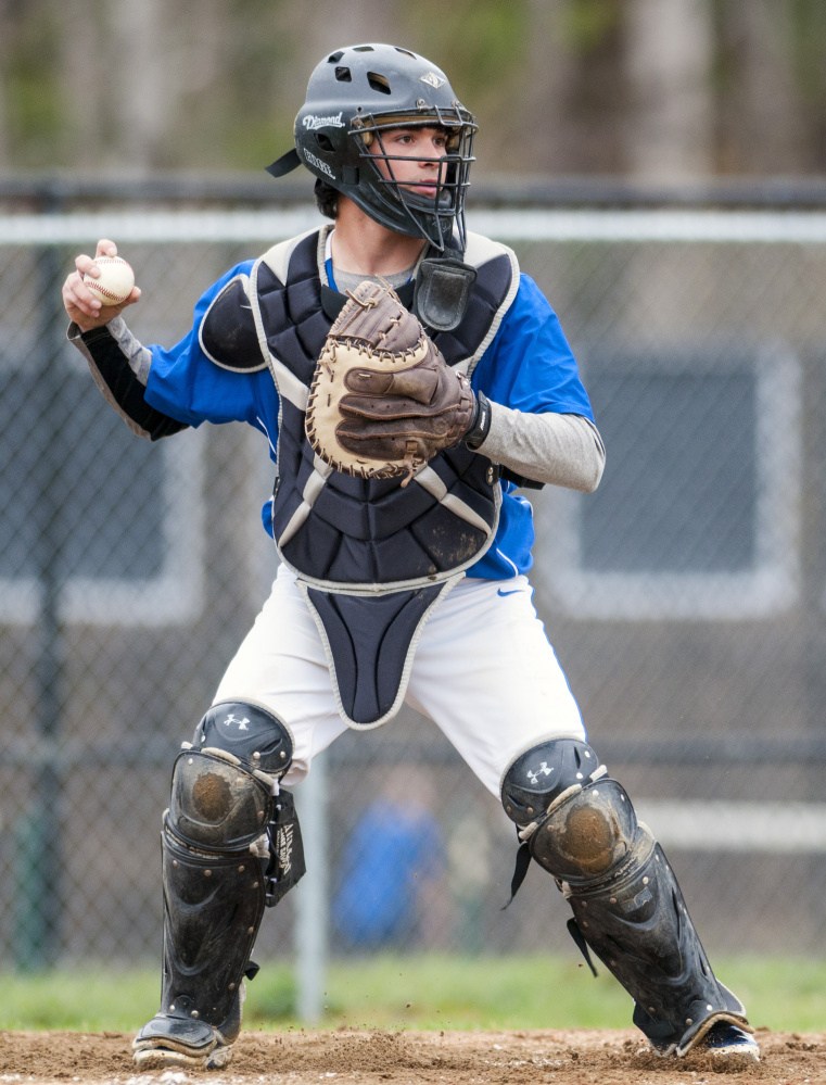 Erskine Academy catcher Nick Turcotte pops up ready to throw in case the runner at first tries to steal during game against Maranacook on Tuesday in Readfield.