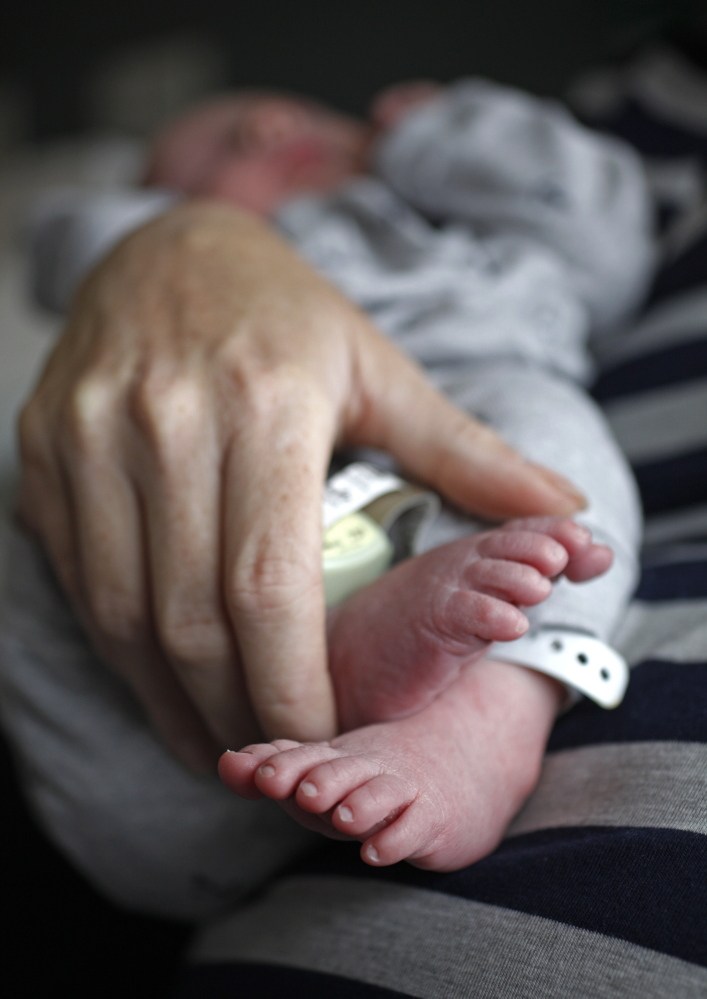 PORTLAND, ME - MAY 9: Ondrea Gallivan, 41, holds her newborn son Aaron Thomas in her room at Maine Medical Center in Portland, Fri. May 9, 2014. According to the U.S. Centers for Disease Control's latest report on vital statistics, from 2011 to 2012 the birth rate rose for women between 30 and 44 years old. (Photo by Amelia Kunhardt/Staff Photographer)
