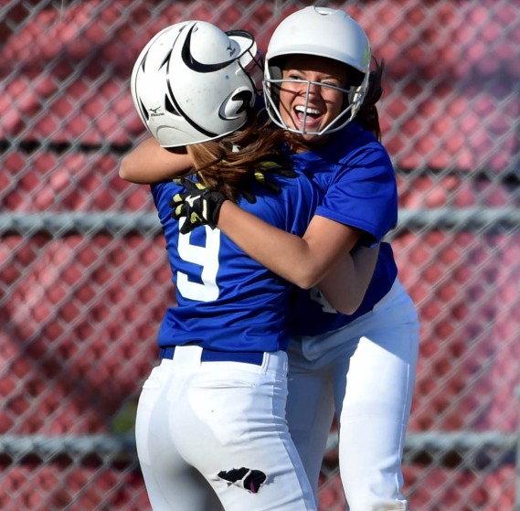 Messalonskee's Madisyn Charest (9) and Kelsey Dillon celebrate a 2-1 walk-off win over Bangor on Friday in Oakland.