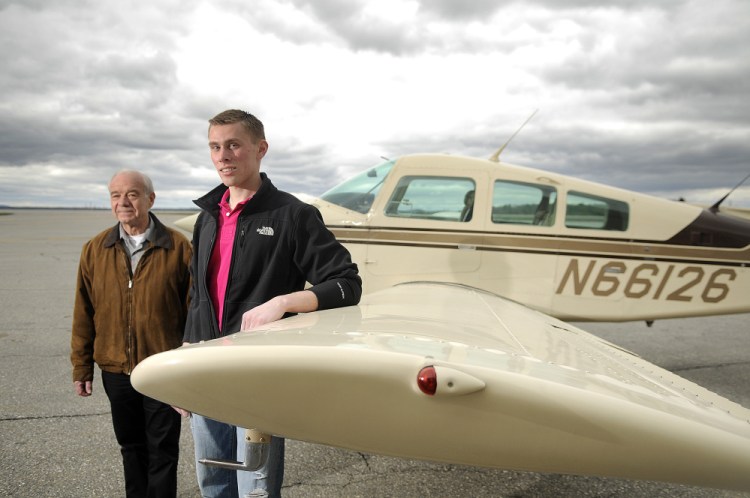 Ben Rogers, right, at the Augusta State Airport on Tuesday with University of Maine at Augusta aviation coordinator, Greg Jolda. Rogers is the first graduate of the program that Jolda oversees.