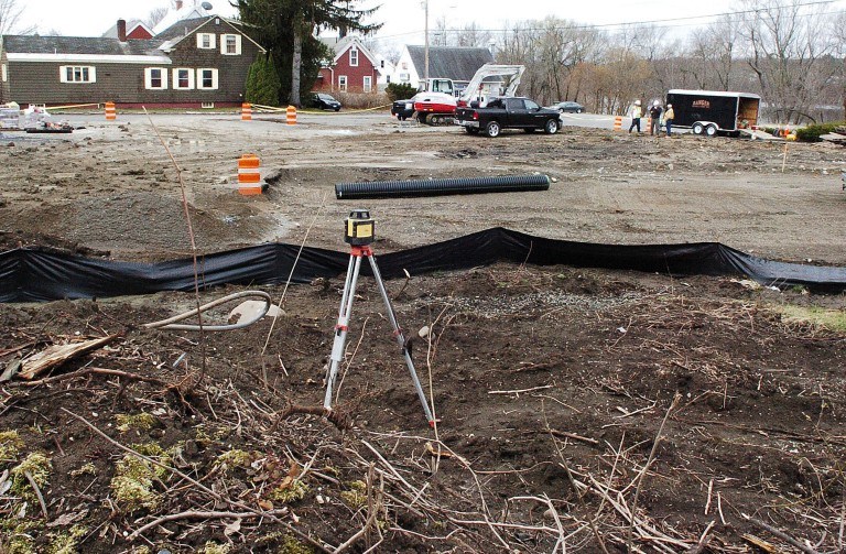 Ranger Contracting Inc. workers begin building a new Dunkin' Donuts restaurant at the site of the former Winslow Car Wash and Red Barn Drive-Thru at 50 Bay St. in Winslow