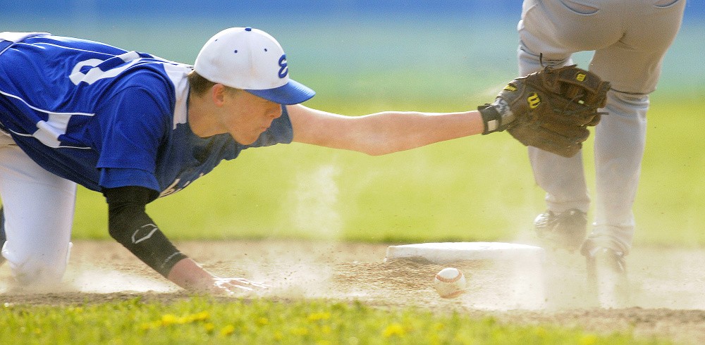 Erskine's Noah Bonsant can't make the tag on Gardiner's Isaiah Swan at second after the ball drops from his glove during a Kennebec Valley Athletic Conference Class B game Monday afternoon in South China.