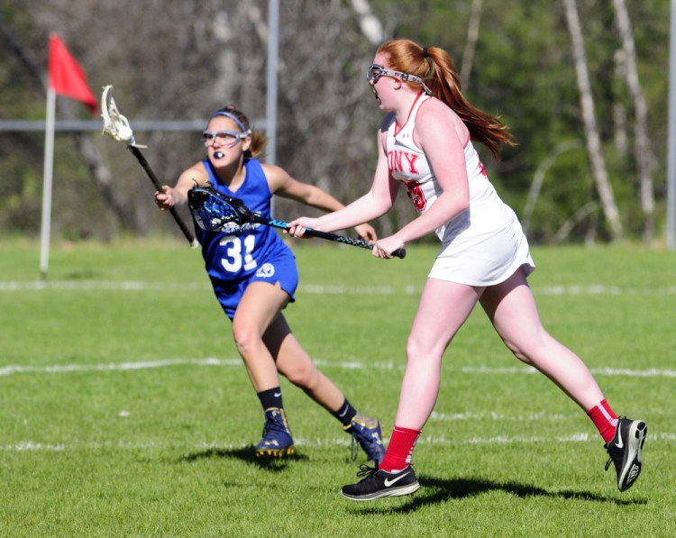 Staff photo by Joe Phelan
Erskine's Isabella Johnson tries to stop Cony's Lauren Coniff as she shoots and scores to make it 4-0 in the first half of a game Tuesday in Augusta.