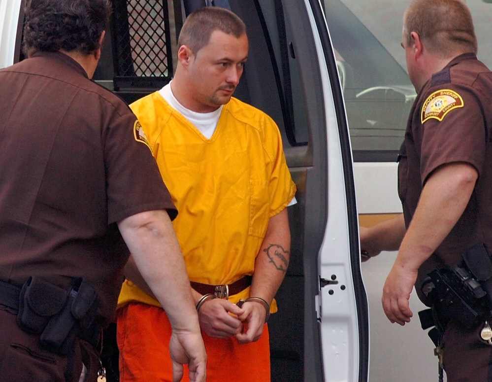 Jeffrey LaGasse is led handcuffed into Somerset Superior Court in Skowhegan where he entered a not guilty plea in the murder charge stemming from the killing of Louise Brochu in 2007.