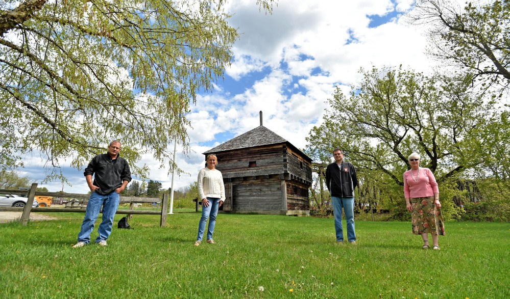 Fort Halifax Days committee members, from left, Ray Caron, Karen Rancourt-Thomas and Jim Bourgoin stand with Virginia Sturies, right, on Thursday in front of Fort Halifax in Winslow.
