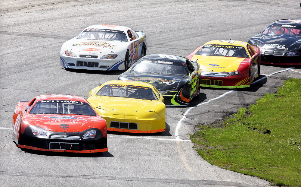 Dave St. Clair, of Liberty, second from left, battles for the lead with Wayne Helliwell, Jr. during a 2014 Coastal 200 qualifying heat at Wiscasset Speedway on Sunday. The annual race is Sunday.