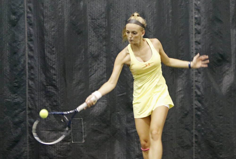 Falmouth senior Julia Brogan competes in the girls individual tennis state championships Monday at the Racket and FItness Center in Portland. Brogan won the tournament.