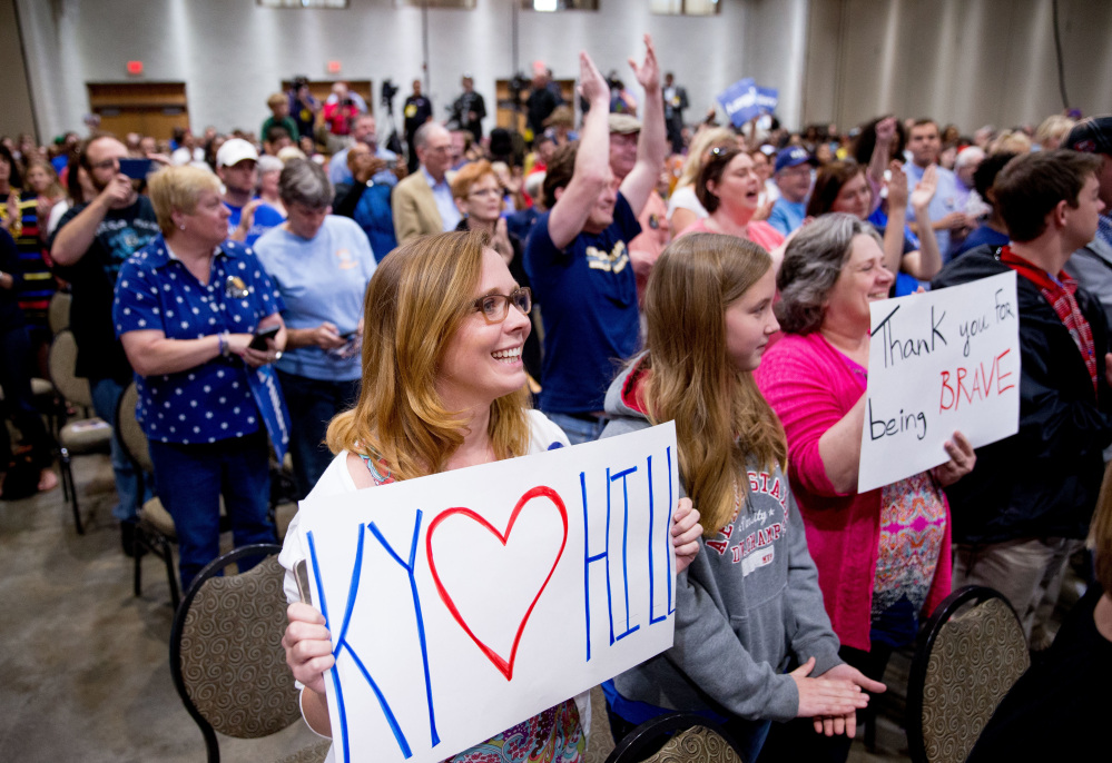 Supporters stand as Democratic presidential candidate Hillary Clinton arrives to speak at an event in Kentucky on Monday.