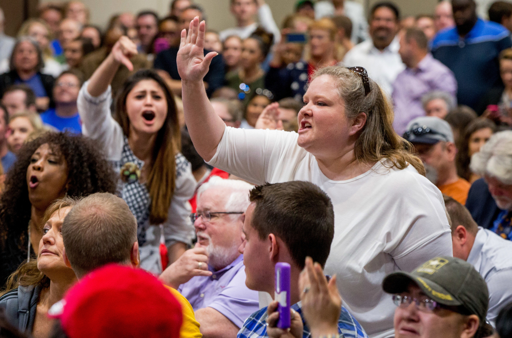 A woman disrupts Hillary Clinton at a Monday event in Hopkinsville, Ky. Clinton pushed back against the protester, who was upset by comments about the state's governor.