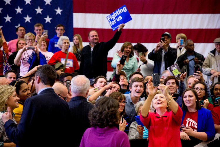 Democratic presidential candidate Hillary Clinton takes a group selfie after speaking at a get-out-the-vote event at Transylvania University in Lexington, Ky., on Monday.