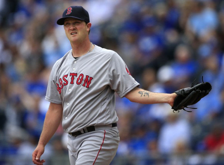 Steven Wright gets a new ball after giving up a two-run homer to the Royals' Eric Hosmer during the first inning of Boston's 3-2 loss Wednesday afternoon in Kansas City.