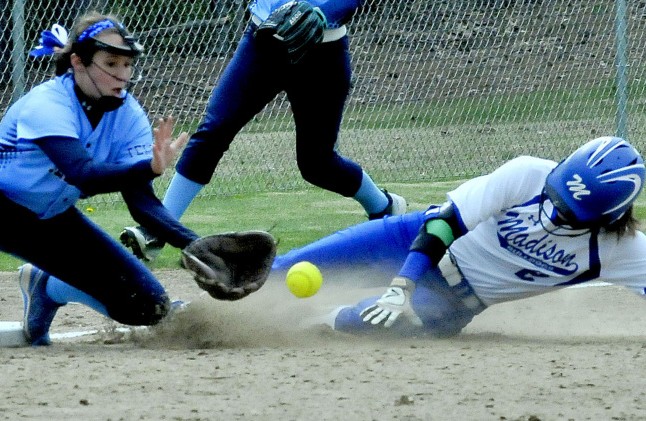 Madison runner Kayla Bess slides safely into third base as Telstar's Becca Howard awaits the throw during a Mountain Valley Conference game last month in Madison. Madison and Telstar enter the Class C South playoffs as the top two seeds.