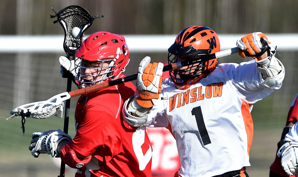 Winslow's Isaac Dugal, right, battles for the ball with Cony's Chad Bickford during a Class B North game last month at Thomas College. The Rams enter the B North playoffs as the No. 2 seed while the Black Raiders go in as the fourth seed.