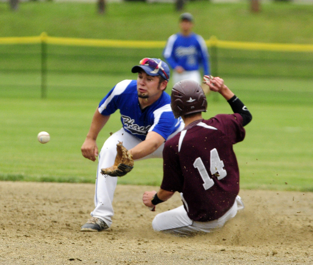 Sacopee Valley shortstop Brady Anderson waits for the throw as Monmouth Academy's Gage Cote (14) slides safely into second during a Class C South semifinal game Saturday in Monmouth.