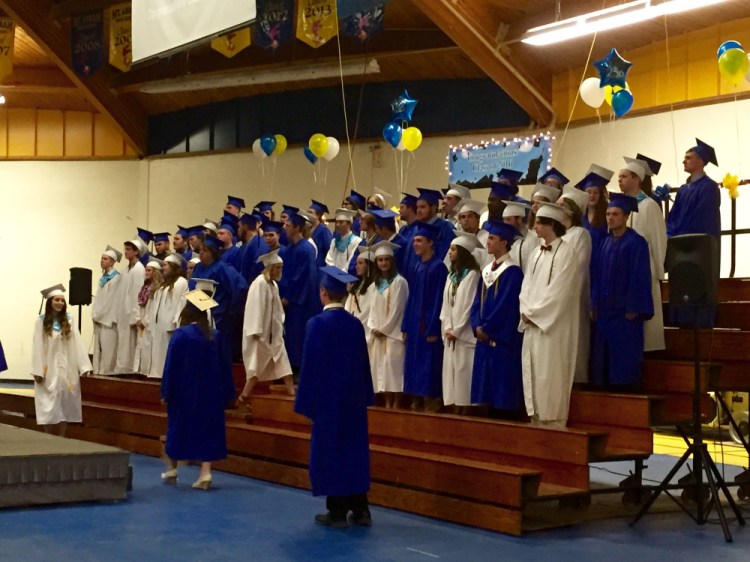 Members of the Mt. Abram High School Class of 2016 march into place Friday evening for their graduation ceremony at the school, which is in Salem Township.