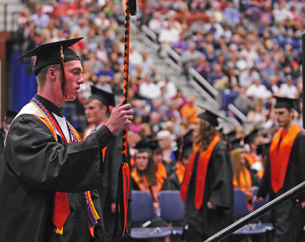 Students march into the Augusta Civic Center on Saturday during the Gardiner Area High School graduation ceremony.