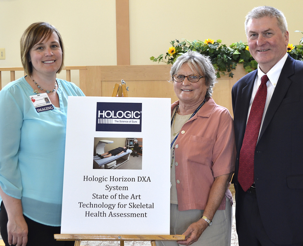 Franklin Memorial Hospital Auixliary recently presented $19,000 to the hospital to help buy the Dual-energy X-ray absorptiometry system. From left are Tammy Frost, Dawn Girardin and Wayne Bennett.