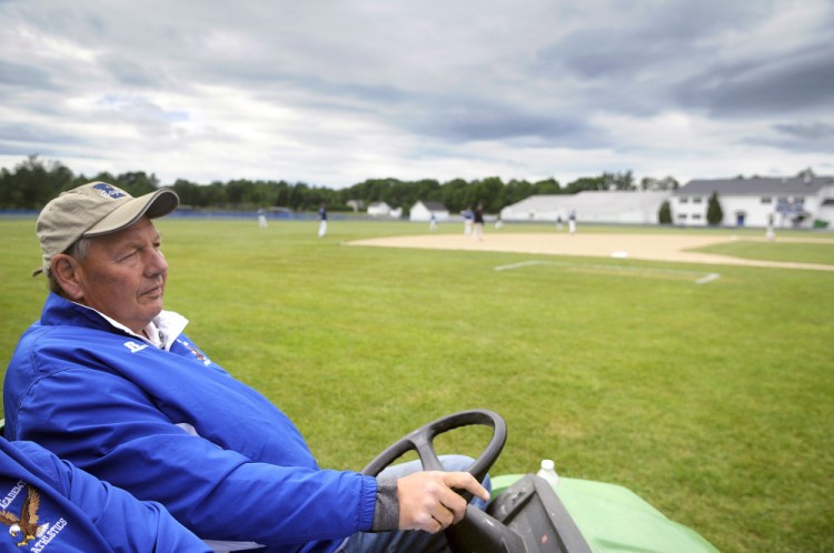 Erskine Academy athletic director Doran Stout watches a baseball game Thursday in South China. Stout is retiring after 22 years as the school's athletic director.