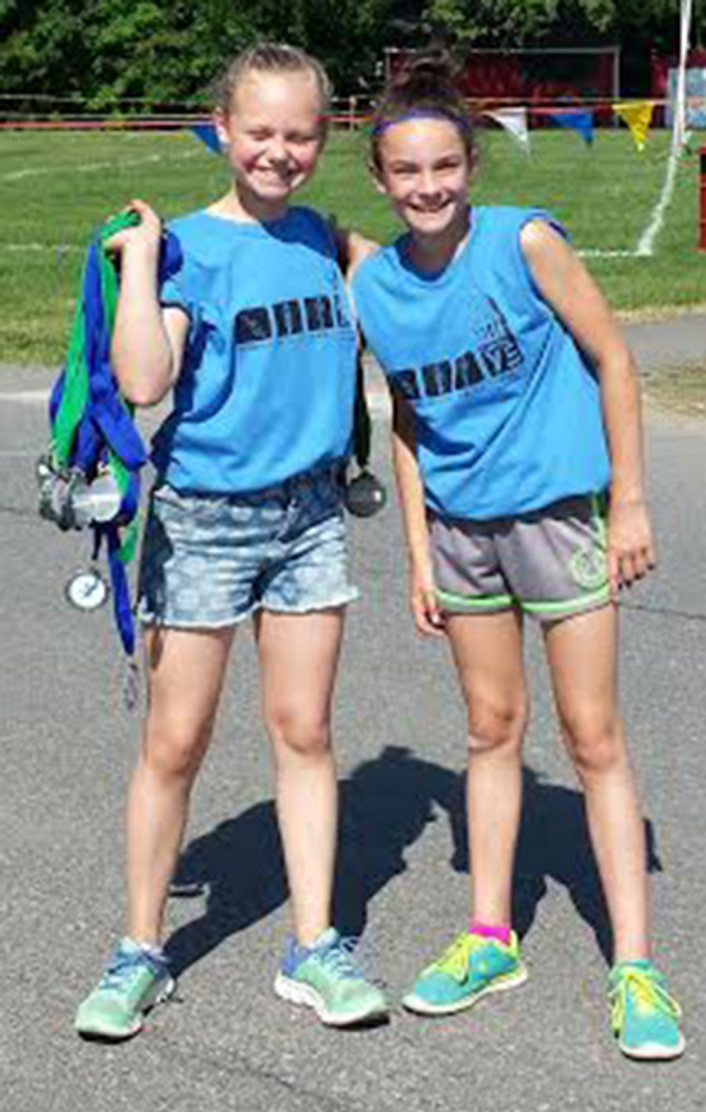 The Kennebec Valley YMCA's Fourth annual Capital Y Triathlon was held May 28. Volunteers, from left, are Olivia Pekins and Lydia Rice.