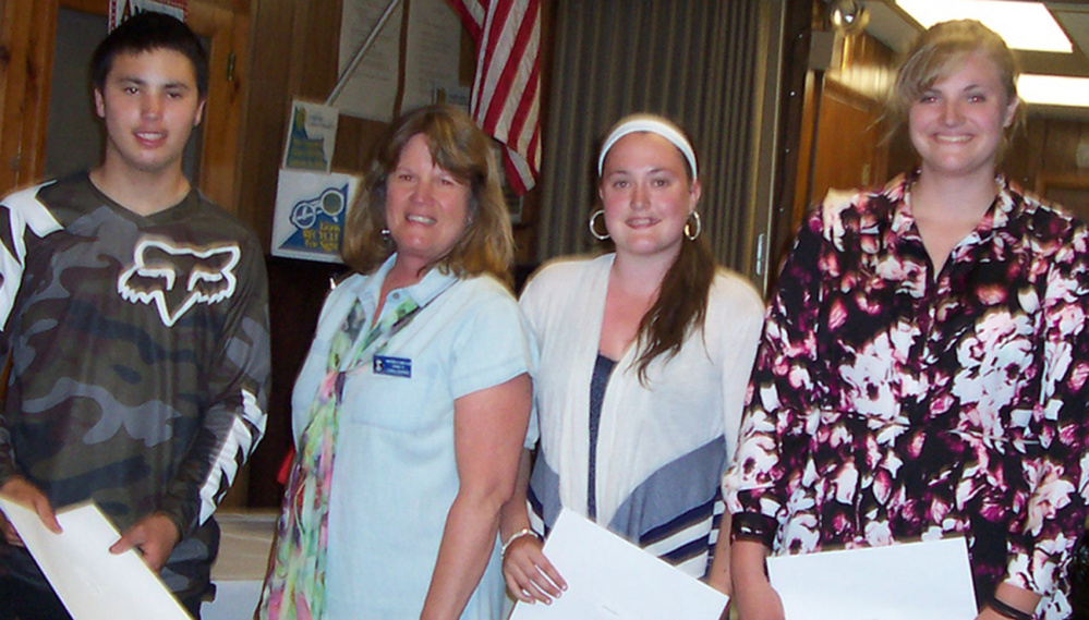 Whitefield Lions Club recently recognized its three scholarship winners. From left, are Donovan Stoops, Whitefield Lions Club President Lynda Despard, Traviana Higgins and Samantha Burke.