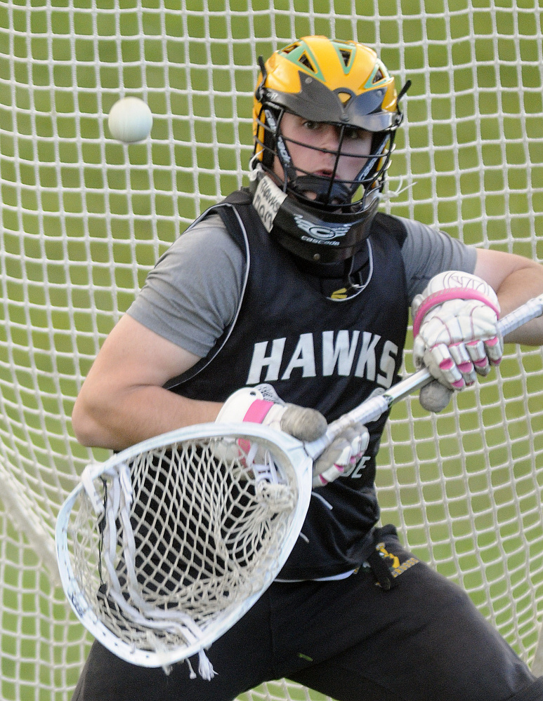 Winthrop/Maranacook goalie Isaiah Weston makes a stop at practice Monday in Readfield.