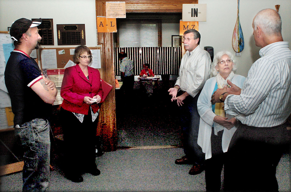 Candidates for the Skowhegan Board of Selectmen Donn Chamberlain, left, and, at right, Betty Austin and Paul Natale, greet town voters along with Anne Amadon and Newell Graf, the two candidates in the Republican primary for House District 77 on Tuesday. Amadon was the winner and will face off with Austin in the November election for the House seat.