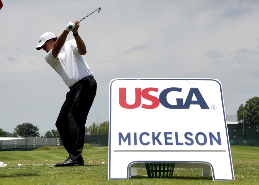 Phil Mickelson hits on the range while practicing for the U.S. Open on Wednesday at Oakmont Country Club in Oakmont, Pennsylvania.